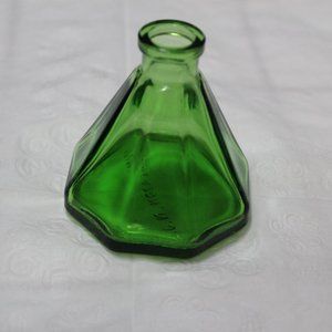 Small green glass empty bottle - marked Wheaton NJ on the bottom